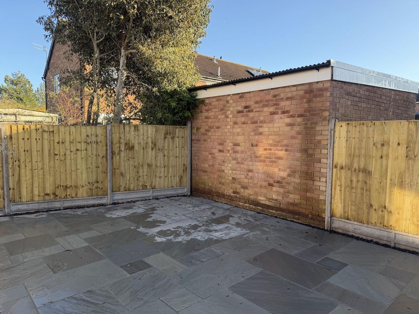 New timber fence panels around a slabbed yard
